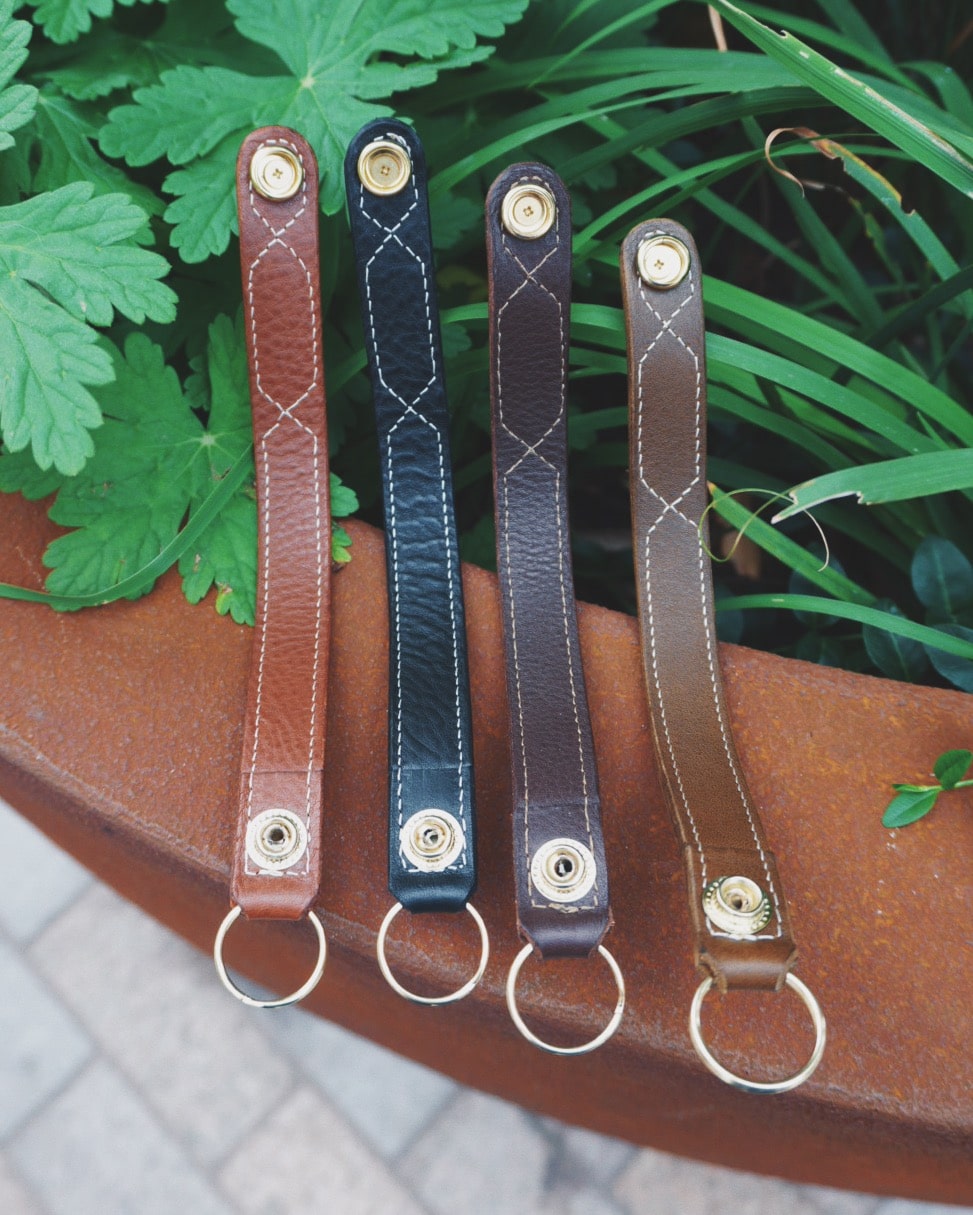 Leather Key Fobs open arrangement with snap attachment, embroidered detail and split ring.